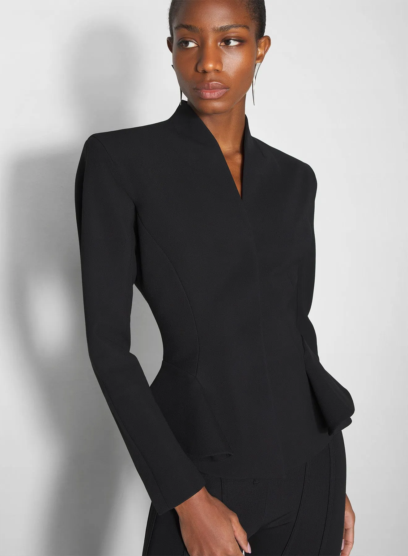 black flared wool jacket Subtle Design Detail